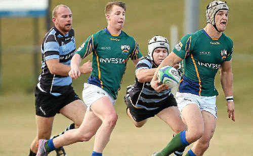 University inside-centre Simon Laing slips past a Maroochydore defender. Picture: Nicholas Falconer