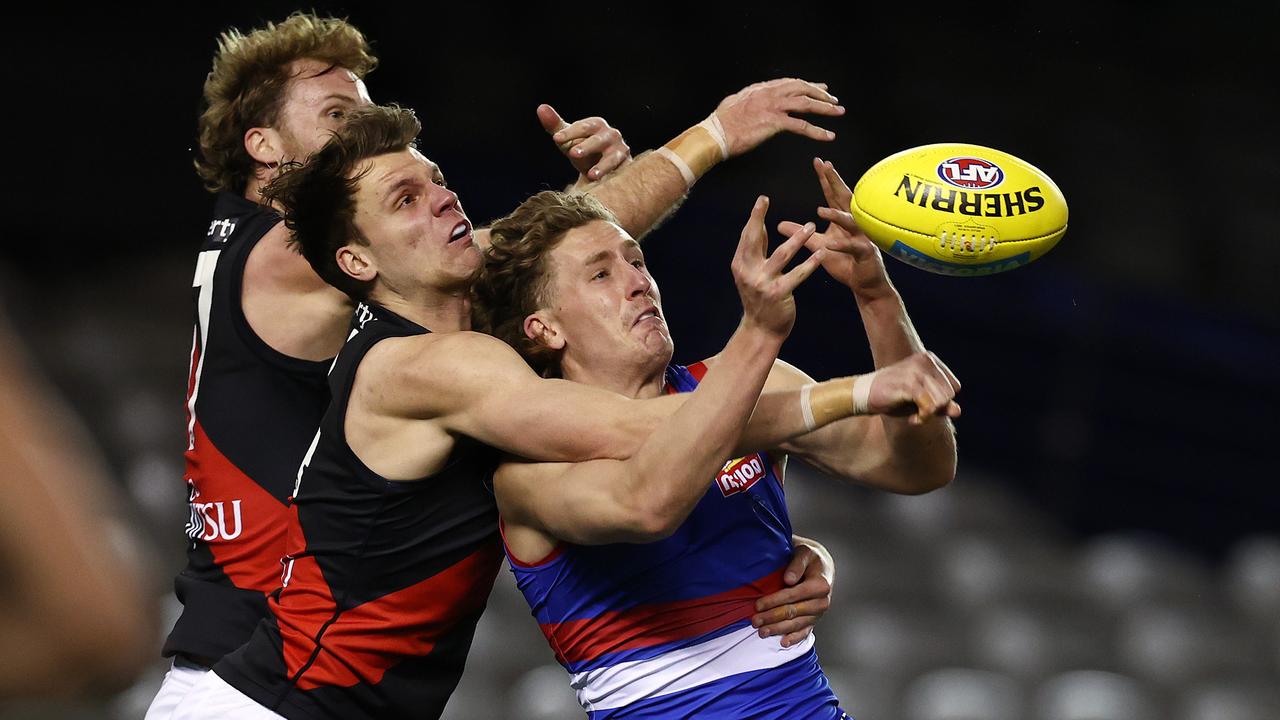 Jordan Ridley and James Stewart spoil an Aaron Naughton marking attempt. Picture: Michael Klein