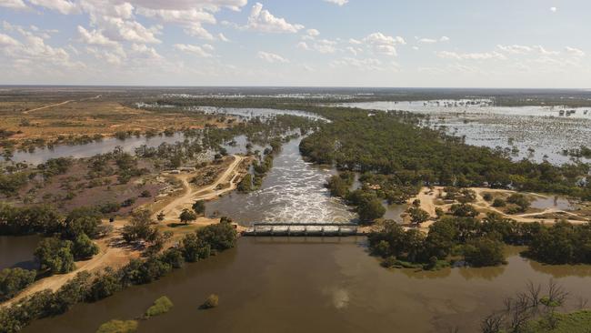 Water flows through the ‘main weir’ out of Lake Wetherell with floodwaters predicted to peak 24cm above the 1976 record of 10.46m. Picture: Michael Minns