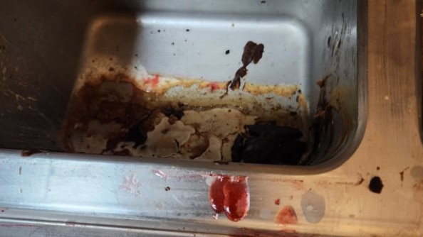 The uncleaned basin which has containers of sundae toppings placed inside it. Picture: Supplied