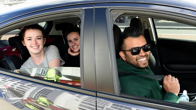 Uber driver Isanka Damith picking up Hayley Duncan and Olivia Piccini from Melbourne Airport today. Picture: Nicole Garmston