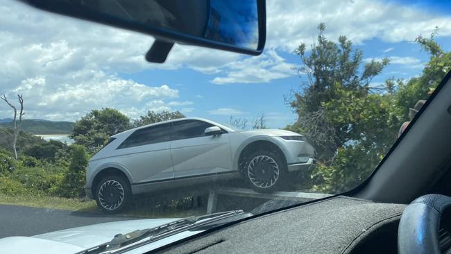 In an unrelated incident, a car ended up on a guard rail at Boambee headland, in Sawtell, around the same time. Picture: Facebook