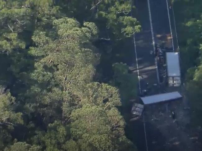 Drone footage shows the scene of a double fatal truck rollover on the Cunningham Highway at Tregony. Images: ABC News