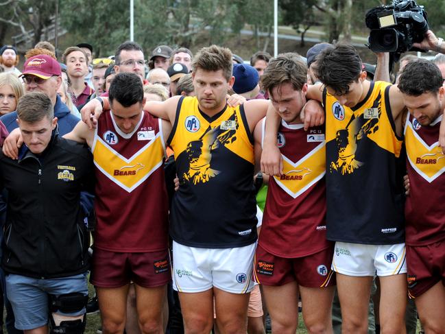 Lower Plenty FC player Lucas Cronin, whose brother Patrick was killed last week after a pub brawl, with opposition Whittlesea players after Lower Plenty's victory. Picture: Andrew Henshaw