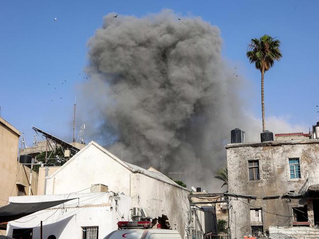 A cloud of smoke erupting following Israeli bombardment on a building in the Daraj neighbourhood of Gaza City. Picture: AFP