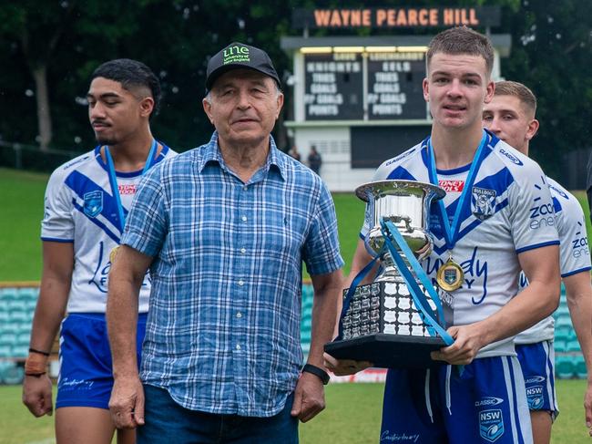 Mitchell Woods (R) with the Harold Matthews Cup last season, is set to transition to U19s SG Ball. Picture: Thomas Lisson