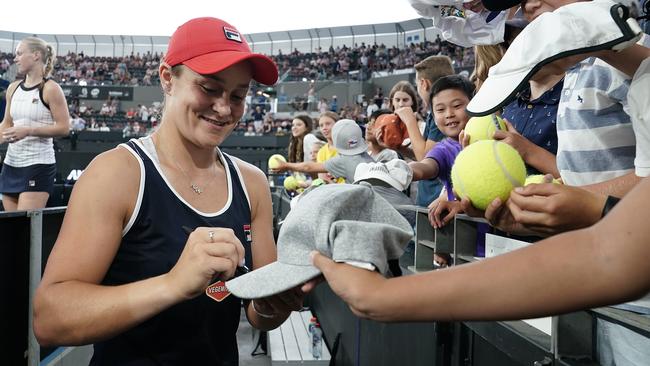 Ash Barty signs autographs following the doubles final at the Brisbane International. Picture: AAP