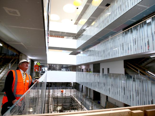 Minister for Health Brad Hazzard looks up at the atrium on a tour of the new Northern Beaches Hospital site. Picture: Damian Shaw.