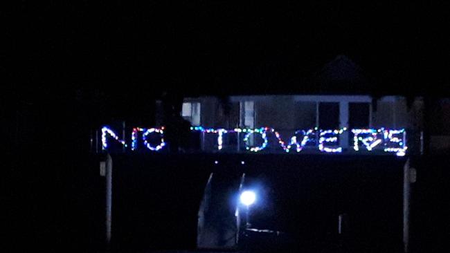 Members of the Newport Action Group are putting their Christmas lights up early to protest the Newport Marina Development Application