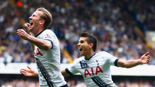 Harry Kane (L) of Tottenham Hotspur celebrates scoring.