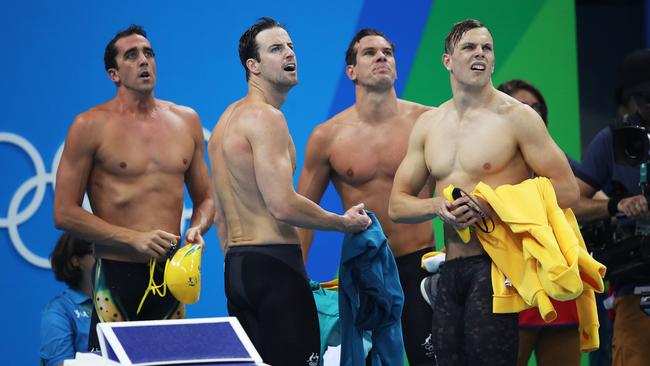 Australia's Matt Abood, James Magnussen, James Roberts and Kyle Chalmers look on at the result finishing 3rd fastest during 4 x 100m Relay heats.