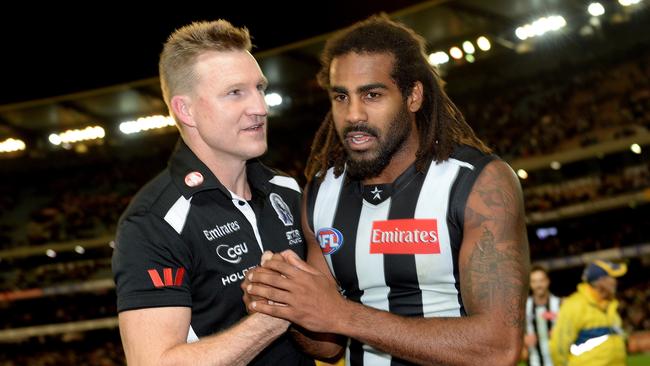 Nathan Buckley celebrates with Heritier Lumumba.