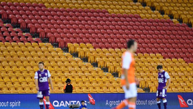 Empty seats are seen in the grandstand during the round 12 A-League match between the Brisbane Roar and Perth Glory at Suncorp Stadium in Brisbane, Thursday, December 21, 2017. (AAP Image/Darren England) NO ARCHIVING, EDITORIAL USE ONLY.