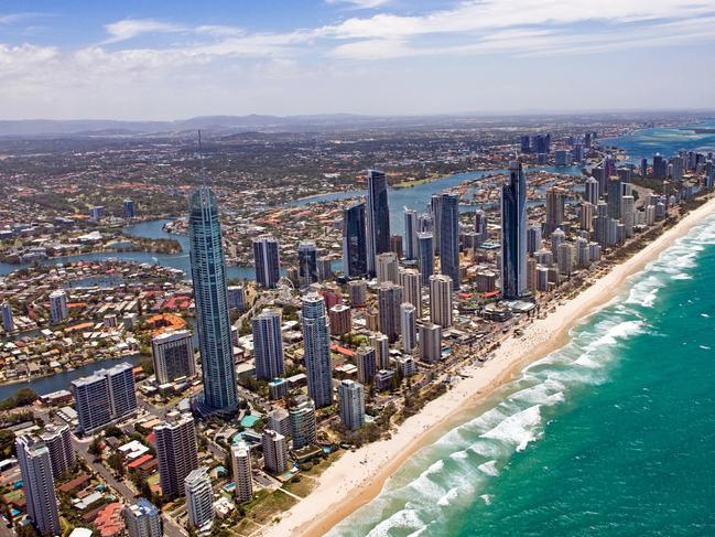 Pictures to be used only for promotion of Lonely Planet Beautiful World Australia book -  Surfers Paradise › High-rise hotels, nightclubs, bars and shopping malls: Surfers Paradise on the Gold Coast is party central and attracts plenty of young people looking for fun. And it does have an incredible beach to boot.Picture: Airphoto Australia | Getty Images ©