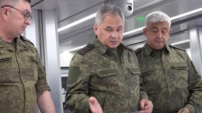 Russia's Defence Minister Sergei Shoigu (C) should discuss the security of Russia’s nuclear weapons with the US. Picture: AFP.