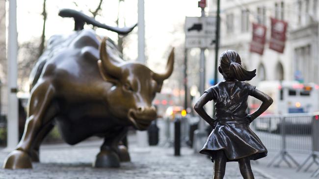 The Charging Bull and Fearless Girl statues. Picture: Mark Lennihan/AP