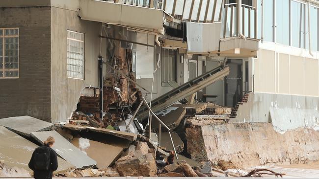 Hundreds of locals have been to survey the damage at The Beach Club at Collaroy Picture: John Grainger