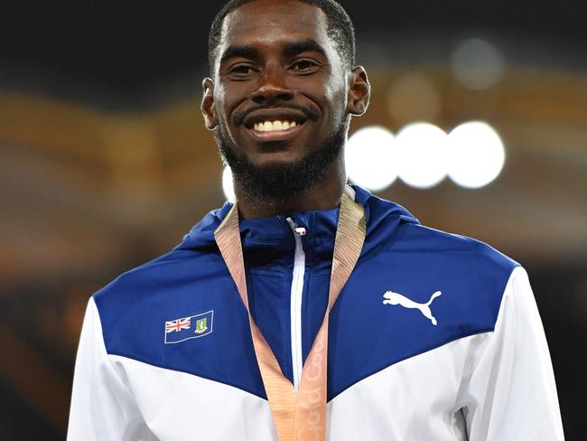 British Virgin Islands’ Kyron Mcmaster (C gold) poses with his medals