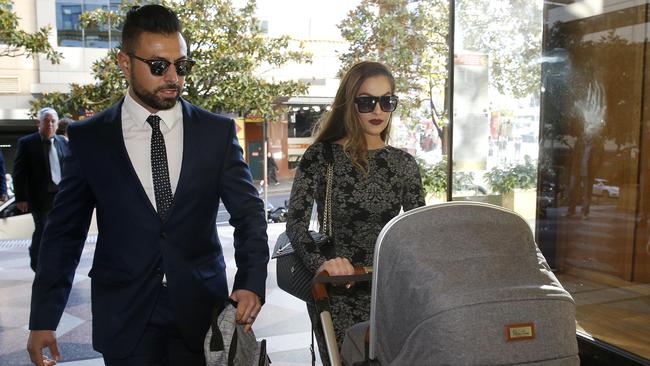 Salim Mehajer's sister Fatima Elkheir arrives at court today pushing a pram, with an unidentified man by her side. Picture: David Swift