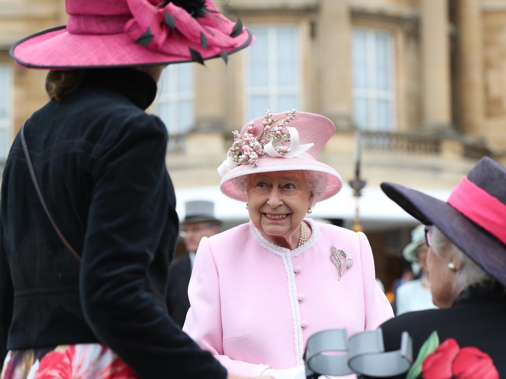 Britain's Queen Elizabeth II meets guests at the Queen's Garden Party in Buckingham Palace, central London. Picture: AFP