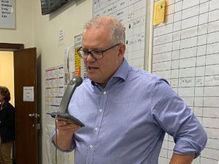 ScoMo appears from out of the smoke