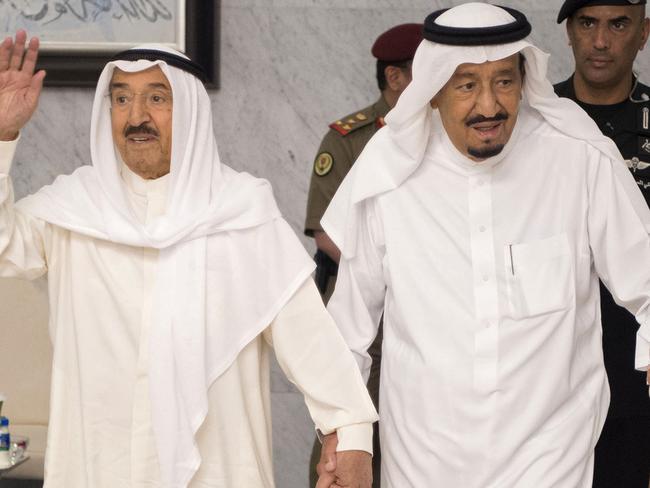 Saudi’s King Salman bin Abdulaziz al-Saud (right) and Kuwait’s Emir Sheikh Sabah al-Ahmad al-Jaber al-Sabah arrive for a meeting in the Red Sea city of Jeddah for talks aimed at resolving the crisis between Qatar and its Gulf neighbours. Picture: Saudi Royal Palace/AFP