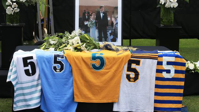Dan Vickerman's five No. 5 jerseys at an emotional service on the Number 1 Oval at Sydney University to remember the much loved former Wallaby.