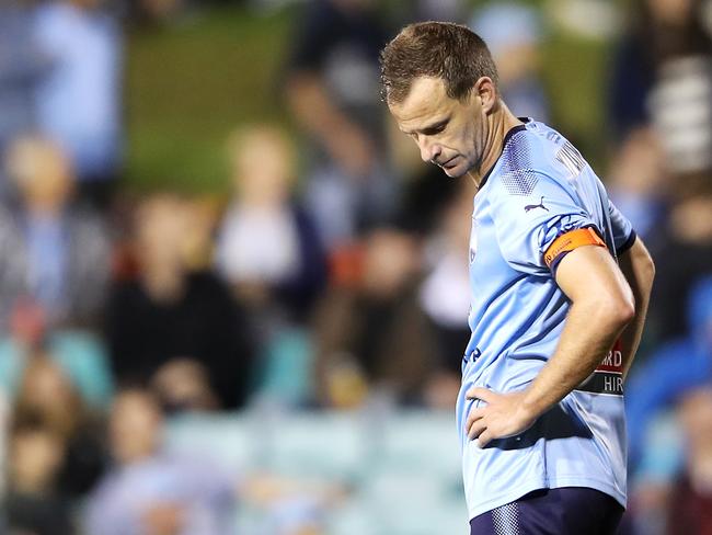 A dejected Alex Wilkinson after Sydney FC’s defeat at Leichhardt Oval.