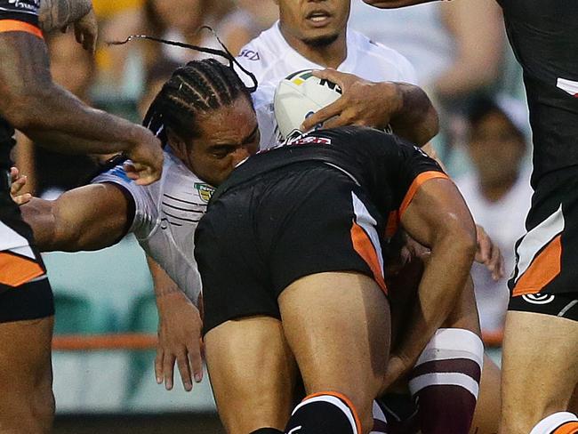 Tigers David Nofoaluma tackles Manly's Martin Taupau during the Wests Tigers v Manly rugby league game at Leichhardt Oval, Sydney. Pic Brett Costello