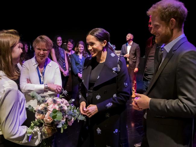 This undated photo, released to the media today, shows Meghan and Harry meeting volunteers at Shout, a free text messaging service for anyone experiencing a mental health crisis, in London. Picture: AFP 