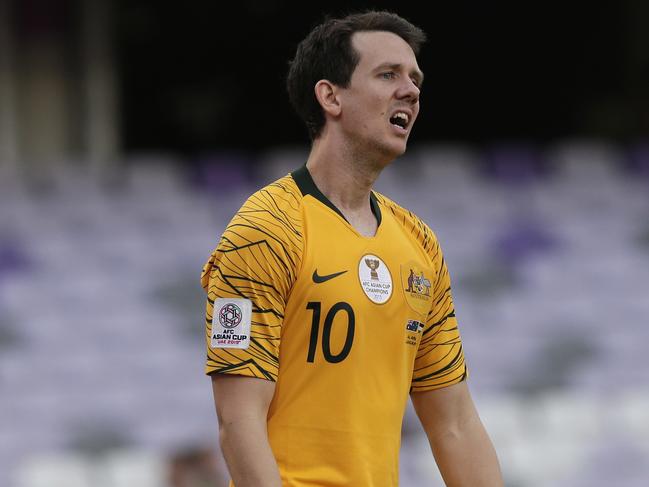 Australia's midfielder Robbie Kruse walks in dejection after Jordan's defender Anas Bani Yaseen during the AFC Asian Cup group B soccer match between Australia and Jordan at the Hazza Bin Zayed stadium in Al Ain, United Arab Emirates, Sunday, Jan. 6, 2019. (AP Photo/Nariman El-Mofty)