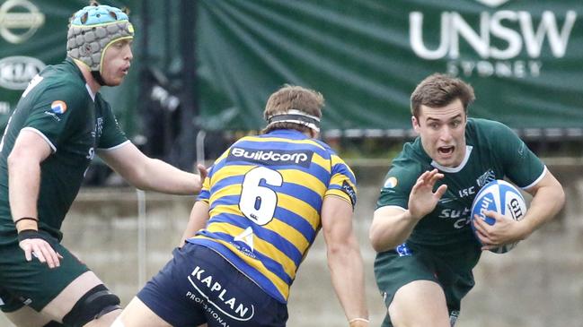 Nick Wilkinson of Randwick tries to evade the Sydney Uni defence. Picture: Ric McLallen