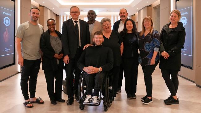 Anthony Albanese, third from left, with members of the Australian delegation of mourners invited to attend Queen Elizabeth II’s funeral: from left, Danny Abdallah, Saba Abraham, Miriam-Rose Ungunmerr Baumann, Dylan Alcott, Valmai Dempsey, Kim Smith, Trudy Lin, Helen Milroy and Shanna Whan during a stopover in Dubai on Friday. Picture: PMO