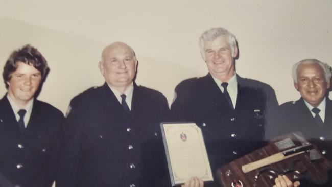 Kingscliff firefighter John Bruhn at his retirement ceremony (third from left) in 1990. Picture: Supplied.