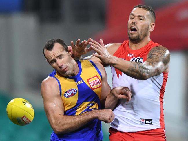 Lance Franklin of the Swans (right) clashes with Shannon Hurn of the Eagles as they chase  the ball during the Round 13 AFL match between the Sydney Swans and the West Coast Eagles at the SCG in Sydney, Friday, June 15, 2018. (AAP Image/David Moir) NO ARCHIVING, EDITORIAL USE ONLY