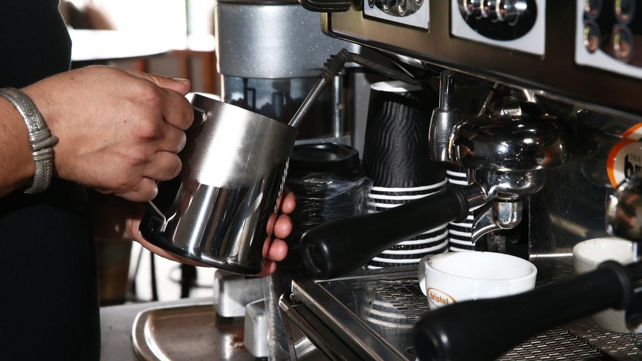 Generic photo of a barista making coffee.