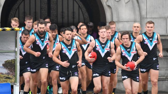 Power players run onto the field at Jiangwan Stadium in Shanghai ahead of the win against Gold Coast. Picture: AAP Image/David Mariuz