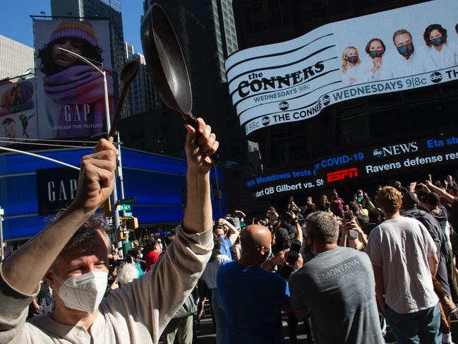 People celebrate at Times Square in New York after Joe Biden was declared winner of the 2020 presidential election. Picture: AFP