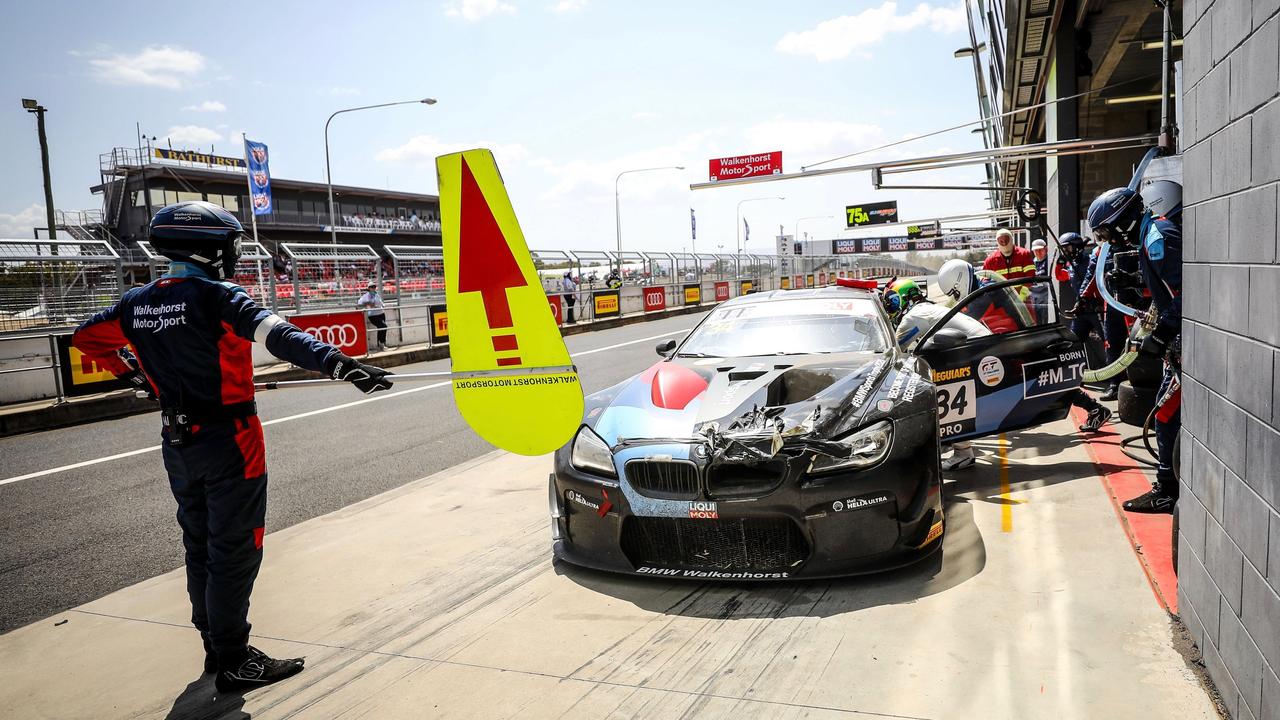 The #34 entry pulls into the pits with damage on the bonnet from the kangaroo. Pic: @BMWMotorsport