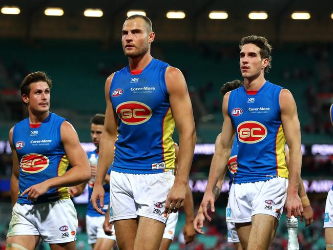 Jarrod Witts of the Suns and teammates leave the field after losing the round 15 AFL match between the Sydney Swans and the Gold Coast Suns at Sydney Cricket Ground on June 29, 2019 in Sydney, Australia. (Photo by Cameron Spencer/AFL Photos via Getty Images)