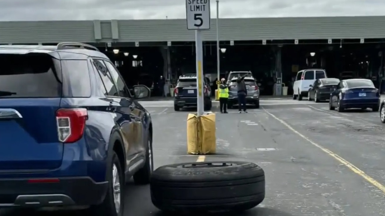 The tyre damaged several cars after it fell off a United Airlines jet during takeoff. Picture: CBS
