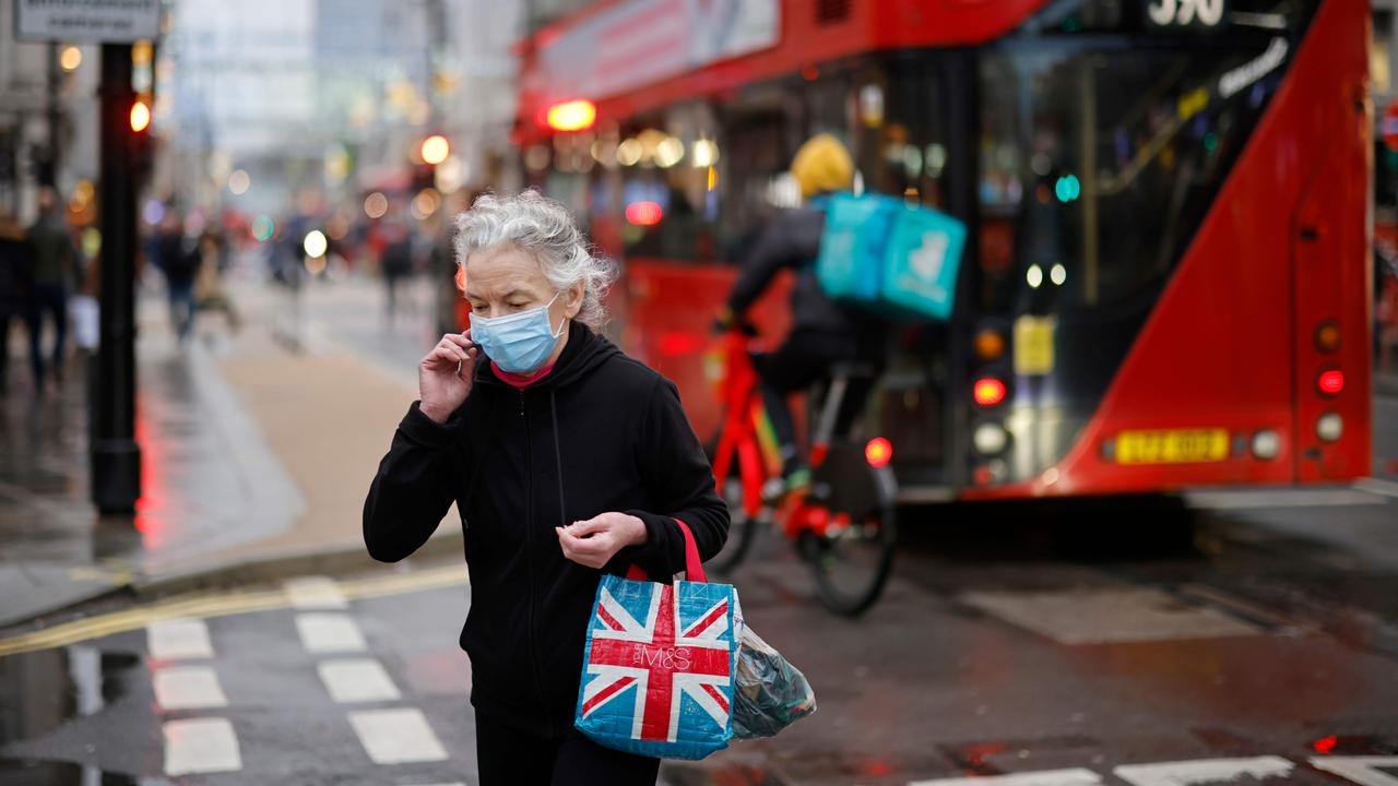 A woman crosses Oxford Street in central London on December 14, 2020, as it is announced that Greater London will be moved into Tier 3 restrictions from Tier 2 from Wednesday December 16. Picture: Tolga Akmen/AFP