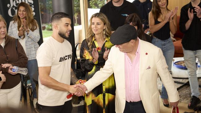 Portelli (left) and Wallis shake hands after another bizarre auction. Picture: Supplied/Channel 9