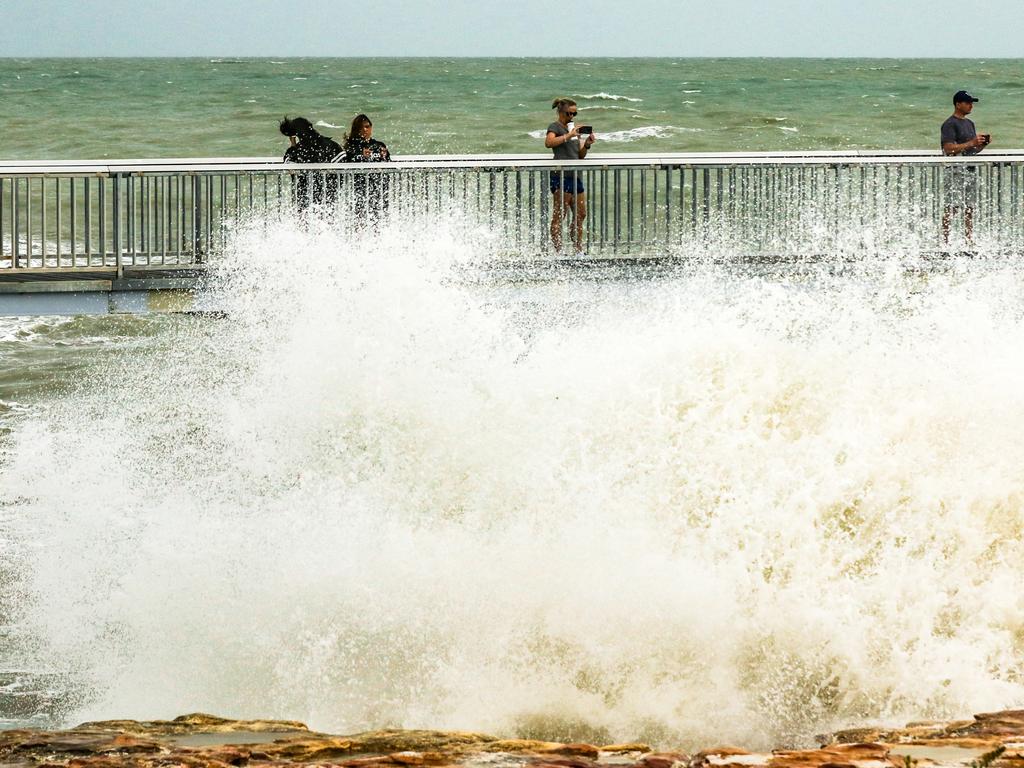 The Nightcliff jetty gets a battering continue as the threat of a cyclone recedes. Picture: Glenn Campbell