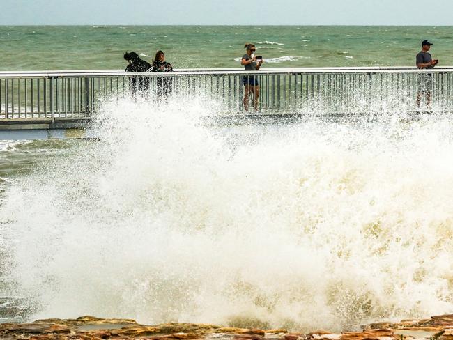 The Nightcliff jetty gets a battering continue as the threat of a cyclone recedes. Picture: Glenn Campbell