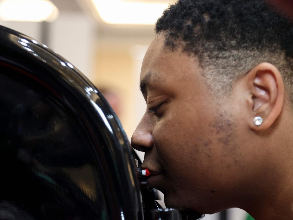 A man has lipstick applied by an AI lipstick machine ahead of the Consumer Electronics Show in Las Vegas. Picture: AFP