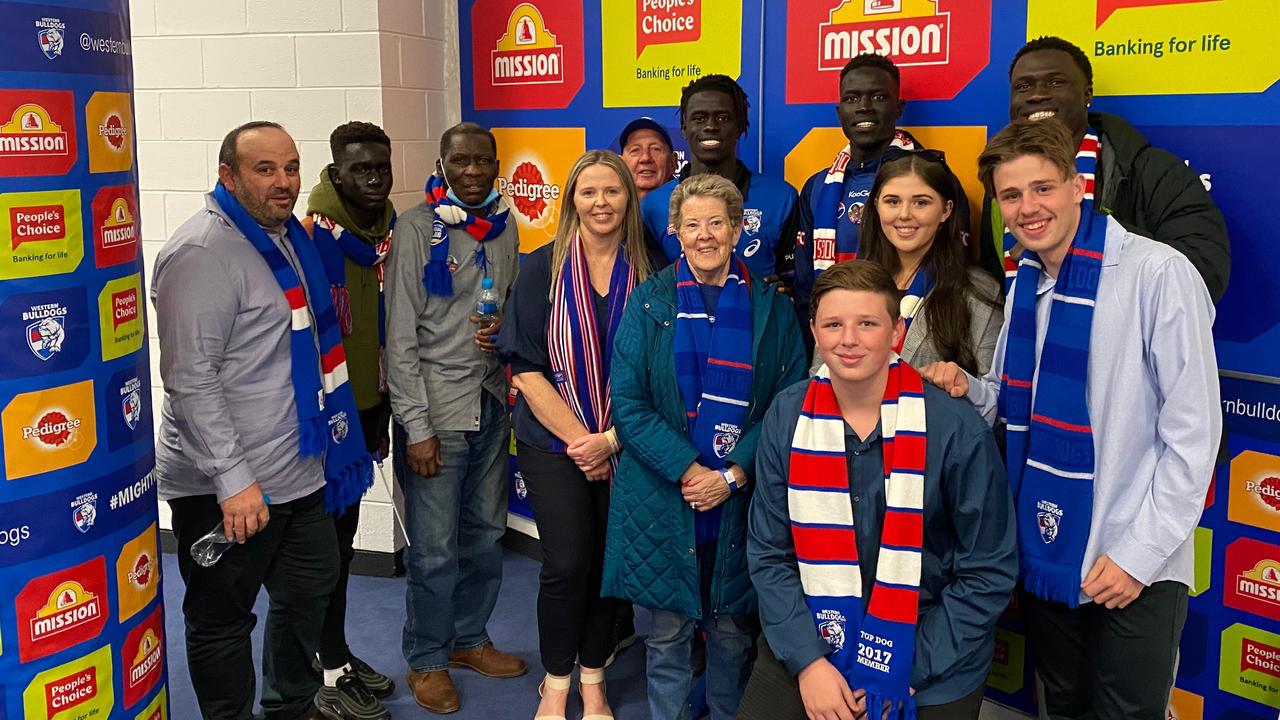 Buku Khamis's family and support network in the rooms after his first game.