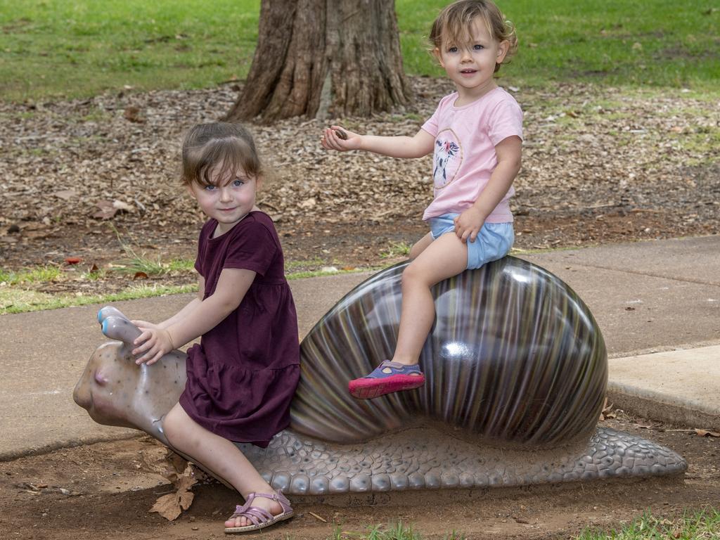 Daisy (left) and Primrose Hughes from Snailed It farm love helping their parents out with their slimy little friends at home. Picture: Nev Madsen