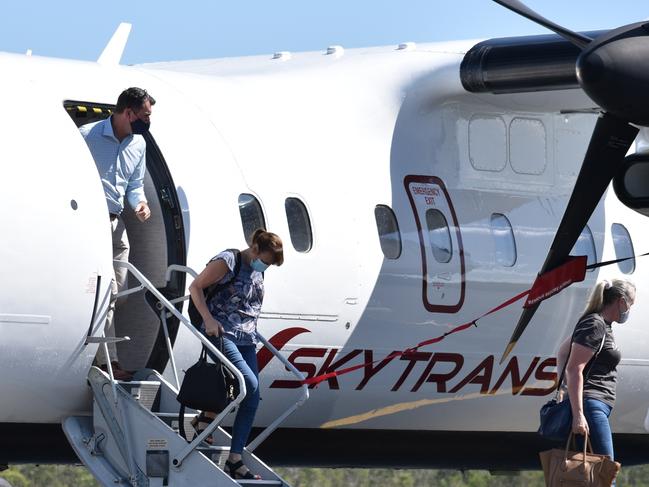 Skytrans' first Cairns to Whitsunday Coast passengers disembark the 34-seater Dash 8-100 at Proserpine on September 13, 2021. Picture: Kirra Grimes