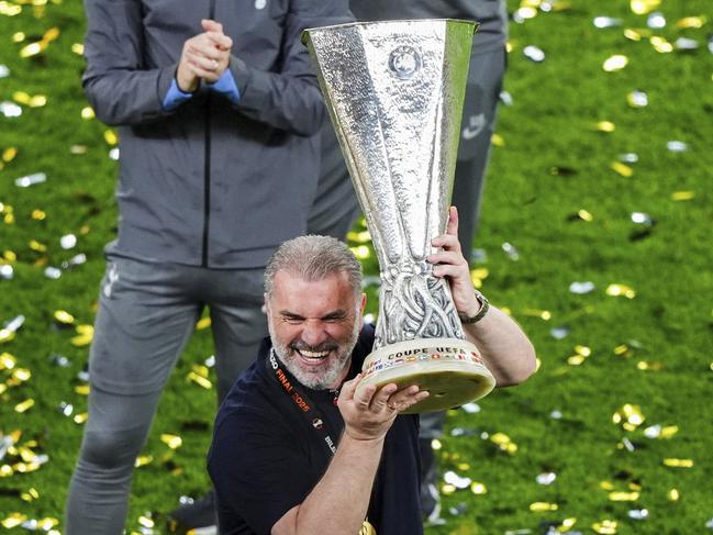 Ange Postecoglou lifts the Europa League trophy after his side’s 1-0 win. Picture: Andrew Milligan/PA